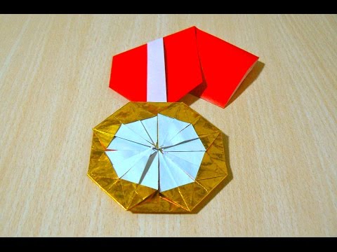 Comment faire médaille d'or. Origami. L'art du pliage de papier.